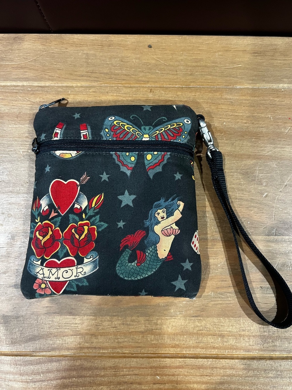 Janine King Designs handcrafted wristlet. Tattoo design. 6 1/2”x6”